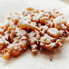 Orange Funnel Cake with Powdered Cinnamon Sugar and Maple Syrup