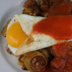 Yukon Gold and Chicken Apple Sausage Hash with Fried Eggs and Spicy Tomato Coulis