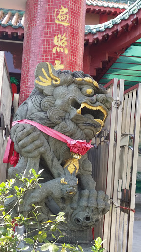 Left Temple Lion Statue