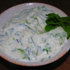 Cool, muddled cucumber raita with a happy hour option