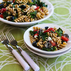 Whole Wheat Pasta Salad with Fried Kale, Tomatoes, Olives, Feta, and Pesto Vinaigrette