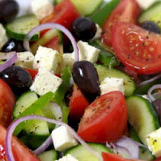 Iceberg and Stilton salad with herb leaves and tomato