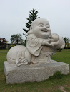 Maitreya with Pig Statue