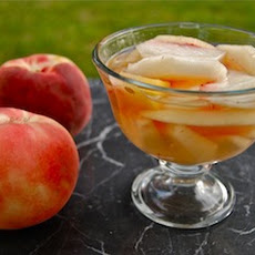 Pesche al vino bianco