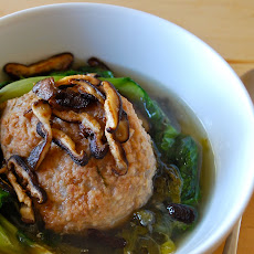 Stewed pork meatballs and escarole with crisped shiitakes