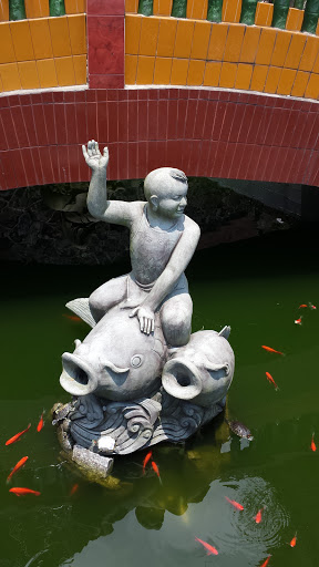 Happy Fish-riding Kid Statue