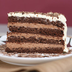 Chocolate layer-mousse cake with cognac and bittersweet chocolate curls