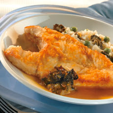 Pan-Roasted Halibut with Morel Confiture, Sweet Pea Risotto and Morel Tea