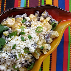 Roasted corn (esquites) with black beans, lime dressing and queso Cotija