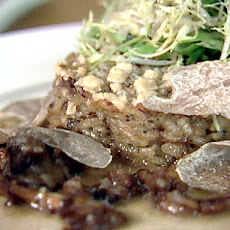 Mushroom Risotto Cakes Stuffed with Duck Liver, Petit Greens, and White Truffles