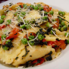 Ravioli With Peas, Tomatoes And Sage Butter Sauce