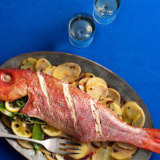 Whole Roasted Fish With Sliced Potatoes, Olives and Herbs