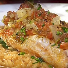 Pan Roasted Bronzini on a Carnaroli Rice, Parmigiano Reggiano and Arugula Risotto with a Provencal Sauce