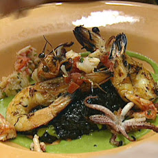 Black Squid Ink Risotto with Grilled Prawns, Lobster and Green Onion Vinaigrette