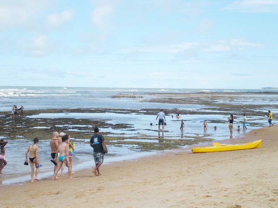 People enjoying beach by Anderson Soares - Travel People