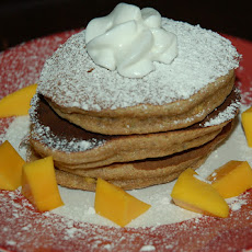 Spelt-Pistachio-Cardamom Pancakes with Mango and Cream