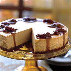 Spiced Pumpkin Cheesecake with Caramel-Bourbon Sauce