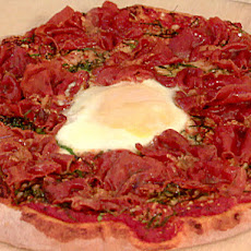 Pizza with Prosciutto, Spinach, Truffle Oil, and Egg
