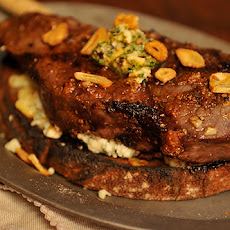 Broiled Spicy Steak with Garlic Chips on Gorgonzola Crostini