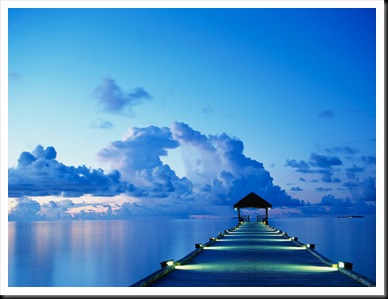 A dock at sunset on White Sands Island in the Maldives.