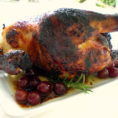 Roast chicken with honey, grapes, rosemary and thyme