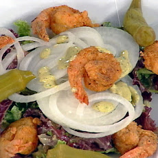 A Creole Fried Shrimp Salad with Vidalia Onions, a Classic Remoulade Dressing and Pickled Okra