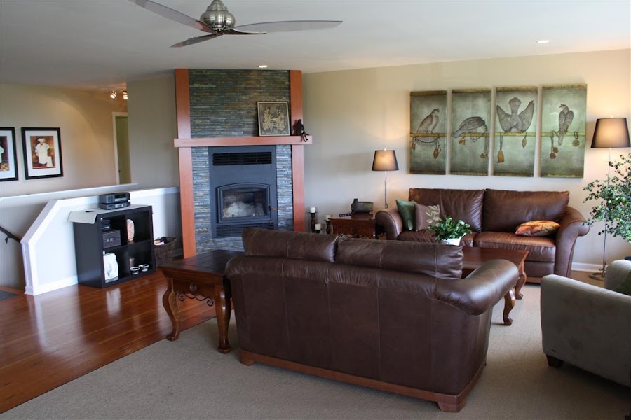 Sophisticated decor with rich wood floors, organic tiles, newly installed Woodburning fireplace featuring beautiful stone masonry.