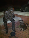 Man and Dog Statue