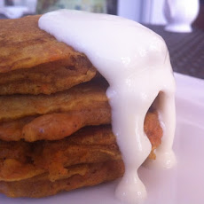 Carrot cake pancakes with orange cream cheese glaze