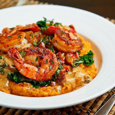 Blackened Shrimp on Kale and Mashed Sweet Potatoes with Andouille Cream