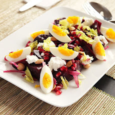 Roasted Beet Salad with Goat Cheese, Eggs, Pomegranate, and Marcona Almond Vinaigrette