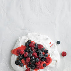 Pavlova with Raspberry Curd and Berries