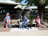 Katie and Chase sitting on the bench with the shrimp at Dixie Crossroads