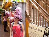 Katie standing in front of the sign explaining who Big Black Dick was and his importance to the islands.