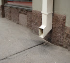 The gutter can be made of stone, or just marked like here.