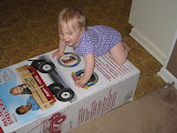 I think she likes the box as much as the wagon...