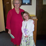 Marilyn and her granddaughter greeting people at the front door