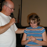 Pastor John praying over Rebekka before her baptism