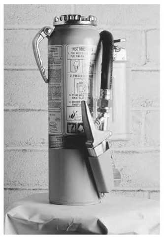 A fire extinguisher contains a high-pressure mixture of water and carbon dioxide that rushes out of the siphon tube, which is opened when the release valve is depressed. 