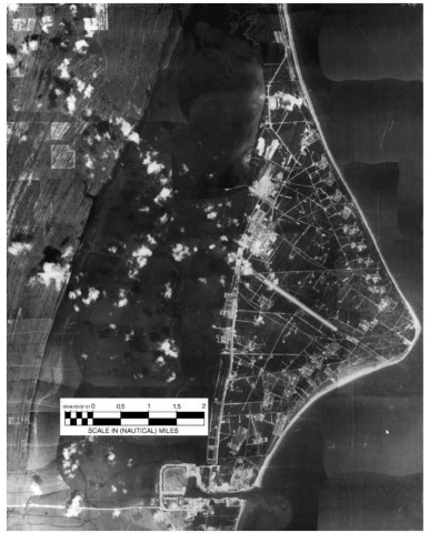 A 1961 aerial photograph of the Cape, with North at the top, showing the Skid Strip in the center, the various launch pads generally along the coast of the Cape, and the Industrial Area to the left of the west end of the Skid Strip.This figure is available in full color at http://www.mrw.interscience.wiley.com/esst.