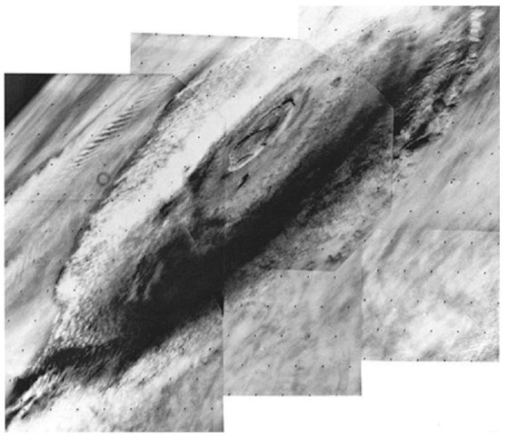  The great Martian volcano Olympus Mons was photographed by the Viking 1 Orbiter on July 31, 1976 from a distance of 8000 kilometers (5000 miles). The 24-kilo-meter-high (15-miles) mountain is seen in mid-morning, wreathed in clouds that extend up the flanks to an altitude of about 19 kilometers (12 miles). The multi-ringed caldera (volcanic crater), some 80 kilometers (50 miles) across, pushes up into the stratosphere and appears cloud-free at this time. The cloud cover is most intense on the far western side of the mountain. A well-defined wave cloud train extends several hundred miles beyond the mountain (upper left). The planet's limb can be seen at the upper left-hand corner of the view. It also shows extensive stratified hazes. The clouds are thought to be composed mainly of water ice condensed from the atmosphere as it cools while moving up the slopes of the volcano. In the martian afternoon, the clouds develop sufficiently to be seen from earth and it is known that they are a seasonal phenomenon largely limited to spring and summer in the northern hemisphere of the planet. Olympus Mons is about 600 kilometers (375 miles) across at the base and would extend from San Francisco to Los Angeles.