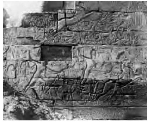 A relief depicting Ramesses II (r. 1290-1224 b.c.e.) in battle array, displayed on a Karnak wall. 