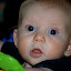 Josiah hanging in his bouncer. Hes like, Whats up?
