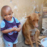  &ndash; Roo and his pet dog, Simba wait patiently as the goat is being prepared. . ..© 2008 Nazareth House Apostolate; all rights reserved