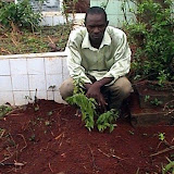  &ndash; Salu at burial of his child, Isha. .......© 2006 NHA 2006. Nazareth House continues a relationship with this family and are helping his other daughter, Salma with scholarships to Freetown School.