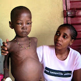  &ndash; Kadijah ministering to Sheku at St. Laurence House. He died the next day, February 2007. .......© 2007 NHA Photos.