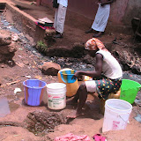  &ndash; Utility shuts off pumps in Freetown causing water shortage. Here a Lady gathers water from dirty gutter. June 2007 (James Mansaray, photographer)
