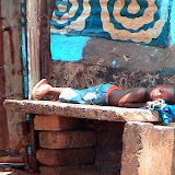  &ndash; Child asleep on concrete slab. May 2007 (James Mansaray, photographer)