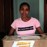  &ndash; Kadijah receiving box of humanitarian aid to St. laurence House from Nazareth House. Feb 2007 (James Mansaray, photographer)
