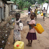  &ndash; Children in Freetown gathering water during water shortage (while Water Company has turned some pumps off). June 2007 (James B. Mansaray, photographer)